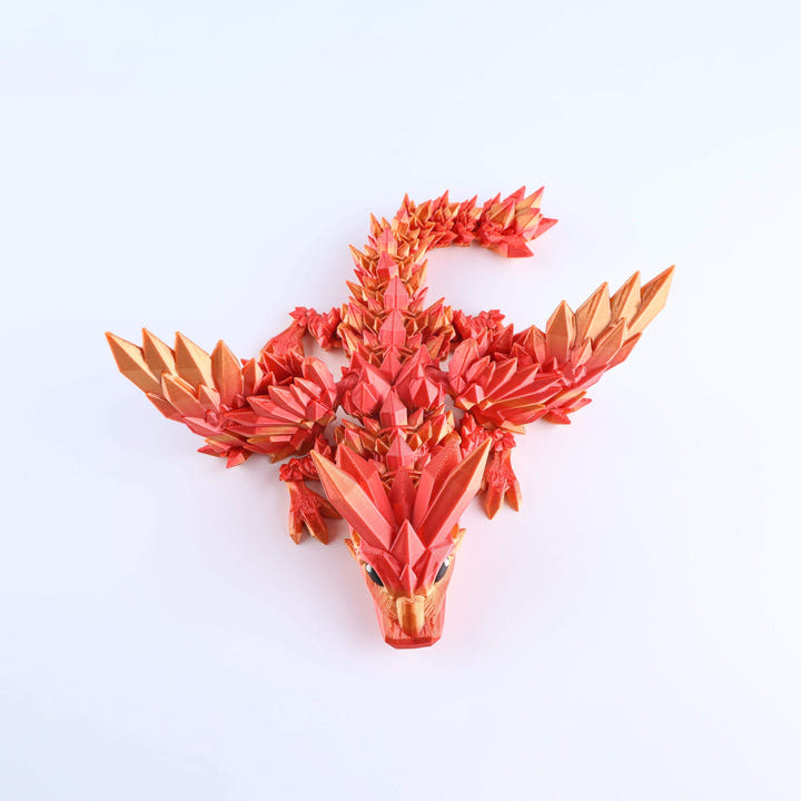 Red and gold dragon head sculpture on a white background