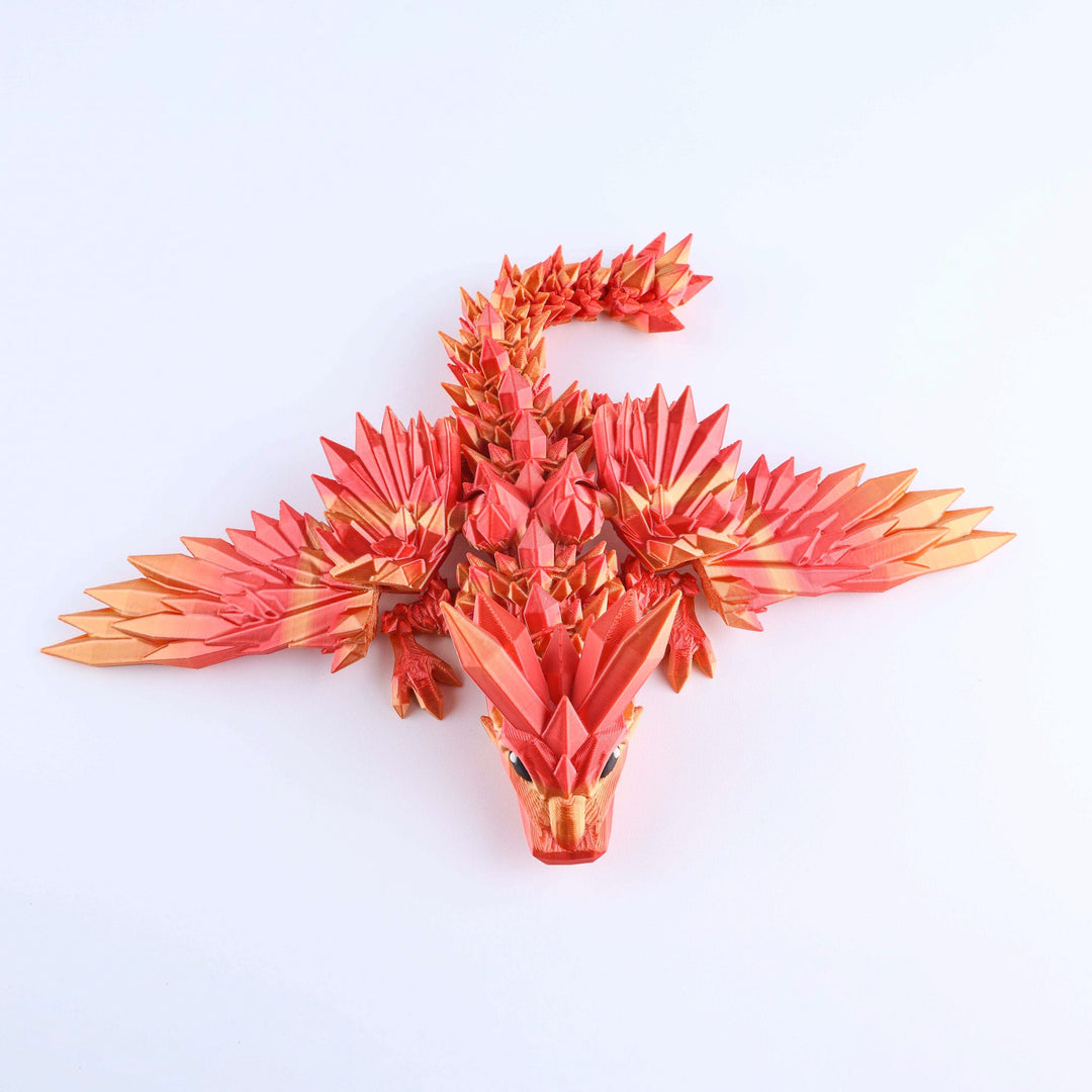 Red and gold dragon sculpture on a white background