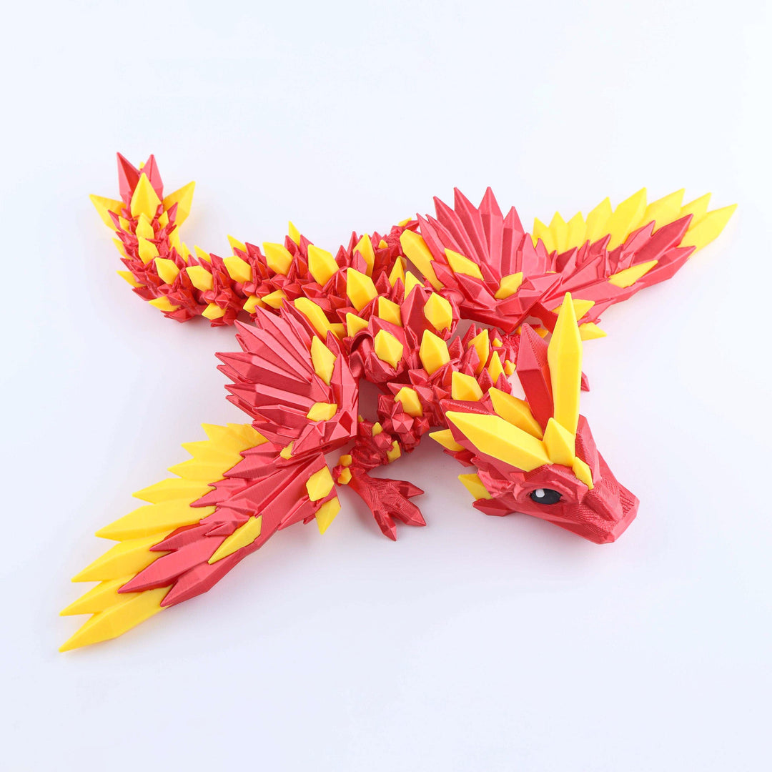 Red and yellow dragon-like creature toy on a white background