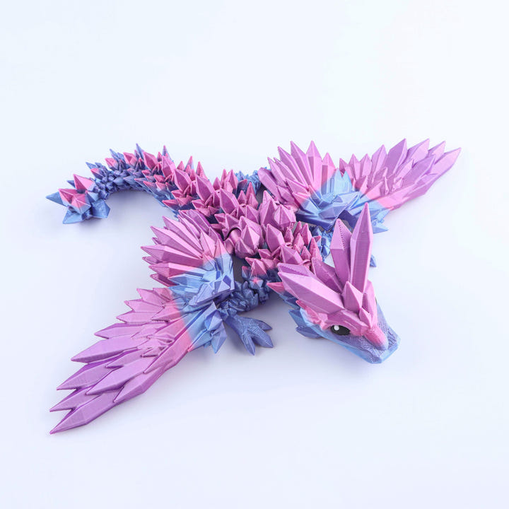 Colorful dragon-shaped toy on a white background