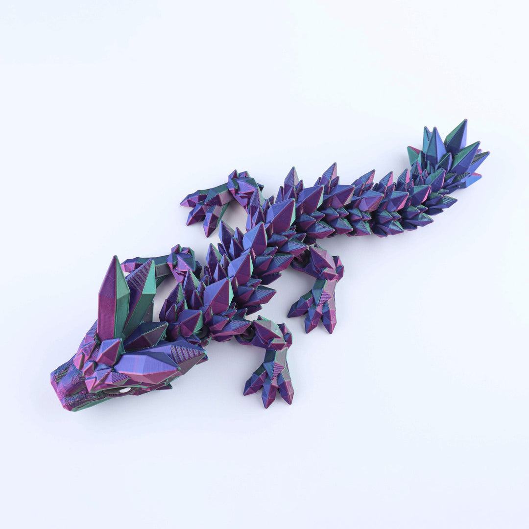 Colorful geometric lizard sculpture on a white background