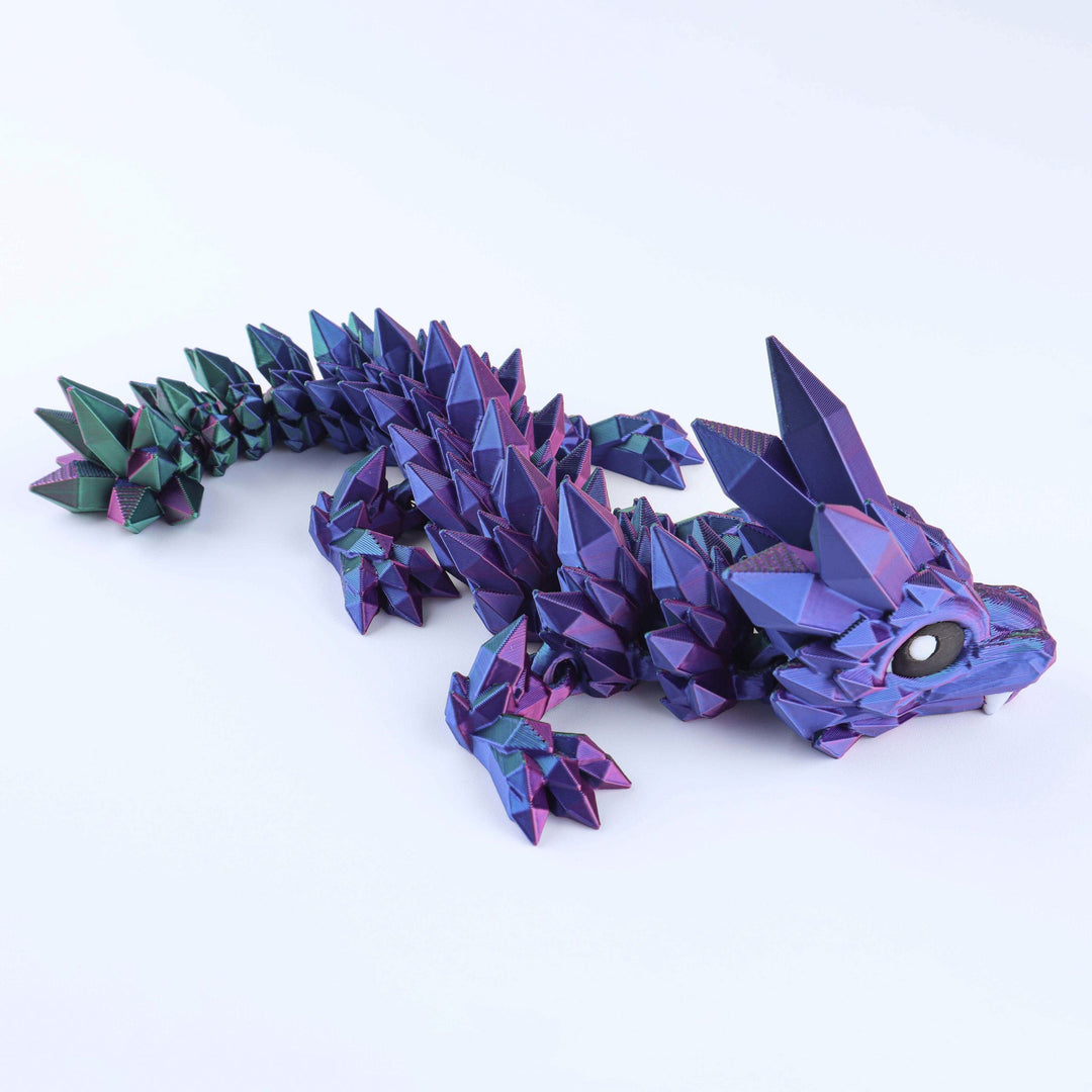 Colorful dragon-like creature toy with a metallic sheen on a white background