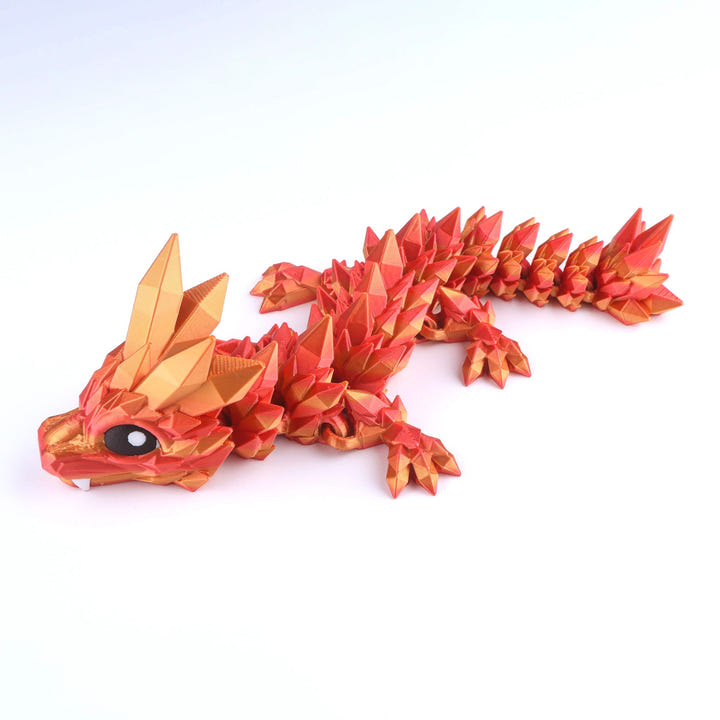 Red and gold dragon figurine on a white background