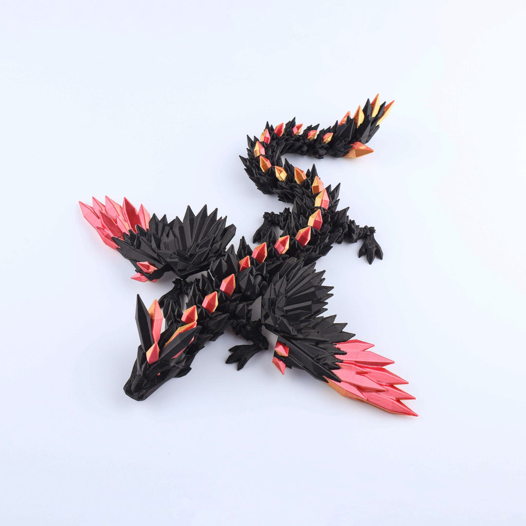 Black and red dragon toy figure on a white background