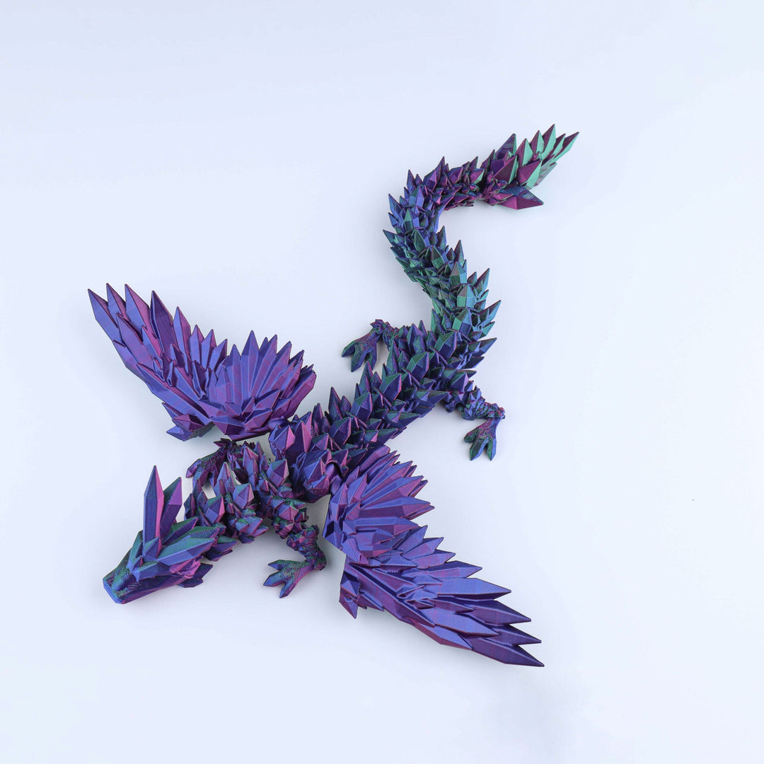 Purple and blue metallic lizard sculpture on a white background