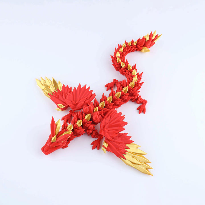 Red and gold dragon toy figure on a white background
