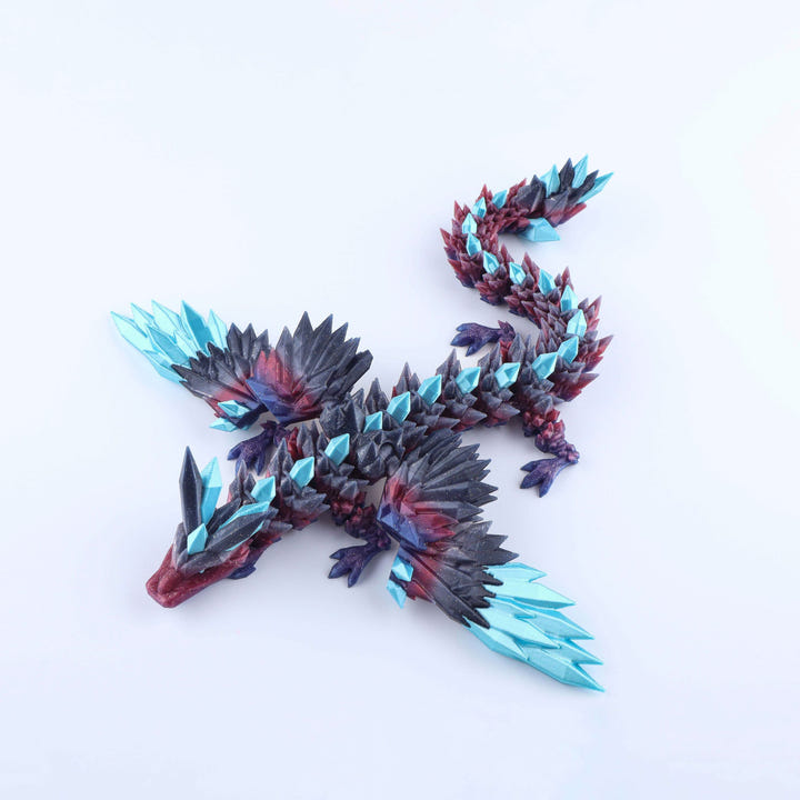 A fantasy dragon figurine with dark charcoal-black scales, deep red and purple underbelly details, and bright cyan crystal-like spikes, displayed on a clean white background.