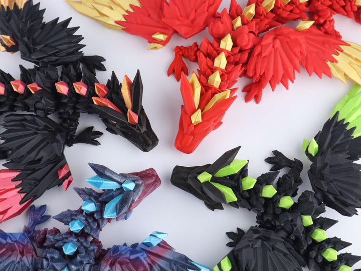 Colorful dragon-shaped toys on a white background