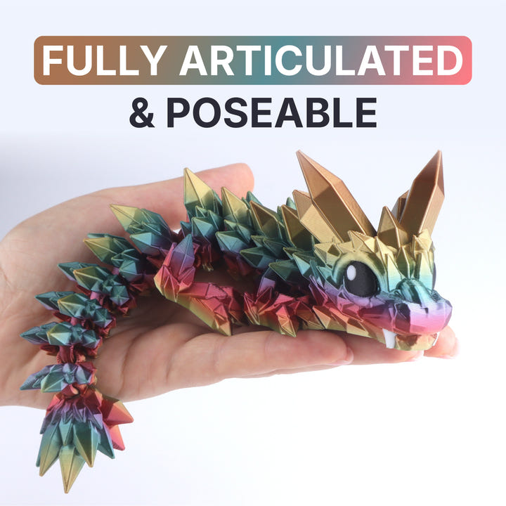 Colorful dragon toy held in a hand with text &