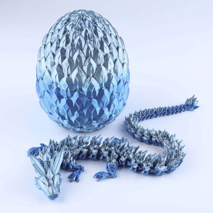 Blue dragon egg and dragon model on a white background