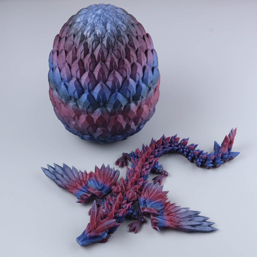 A 3D-printed articulated fantasy dragon figurine shown next to its matching scaled egg on a light gray background.