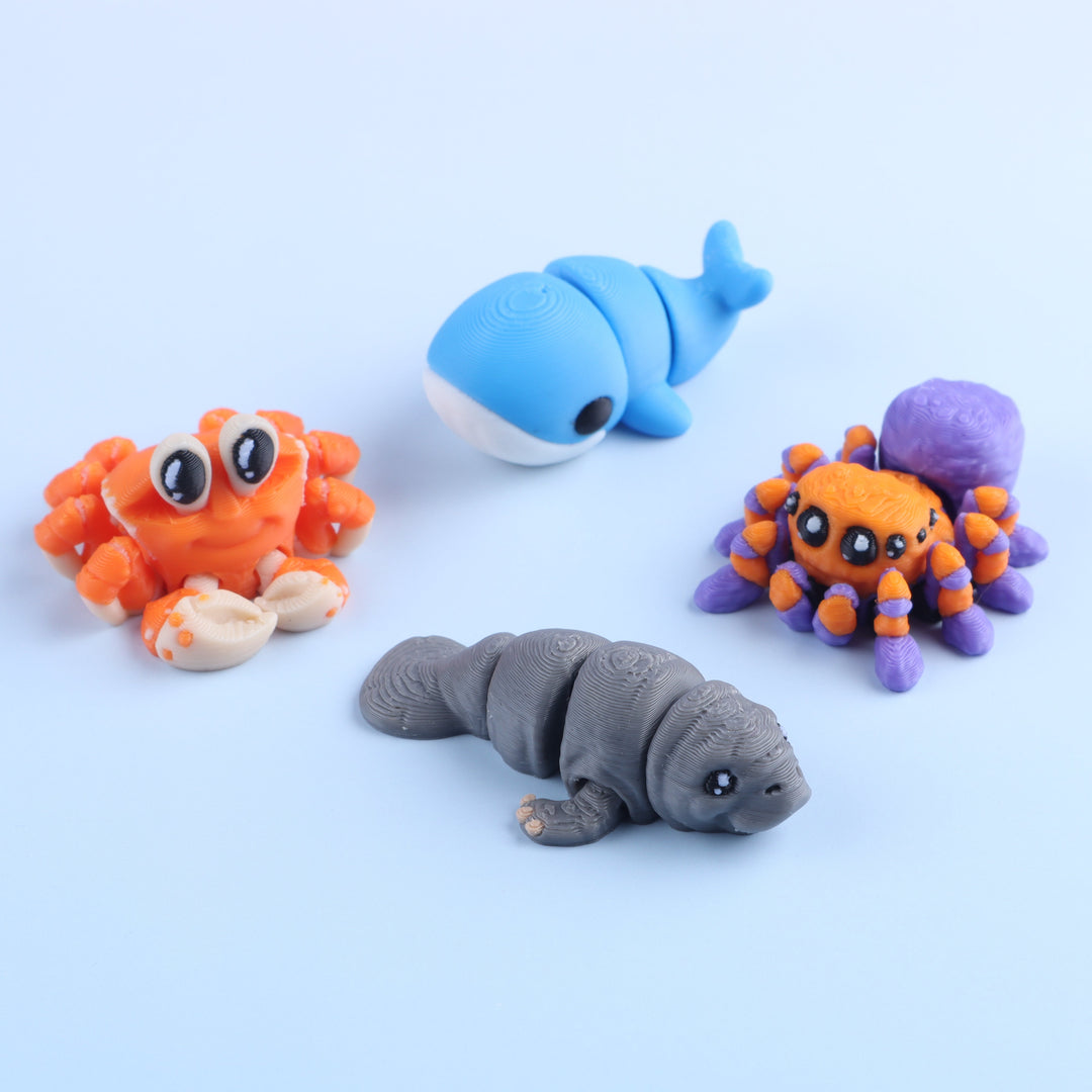 Set of colorful clay animal figurines on a light blue background