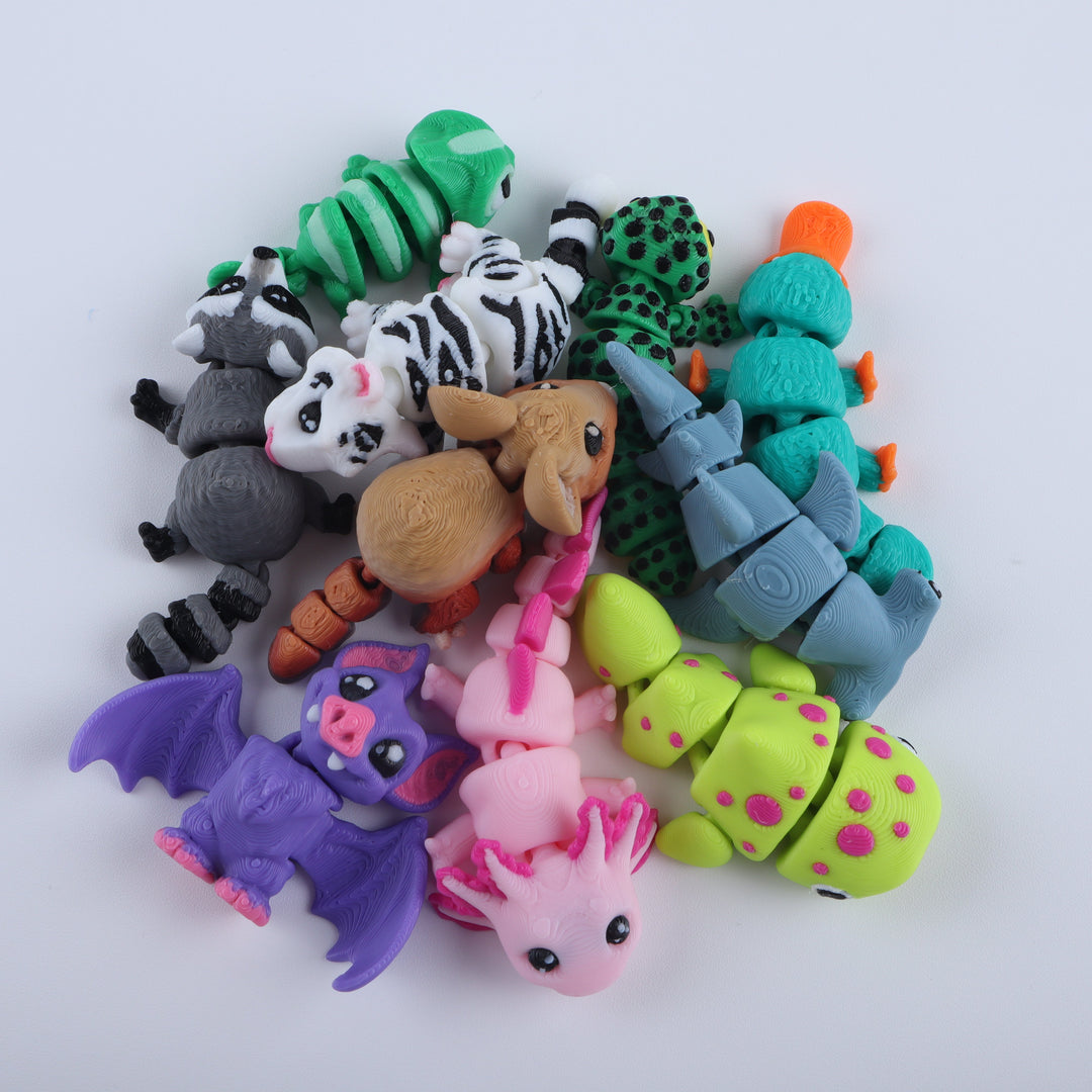 Collection of colorful animal-shaped erasers on a white background