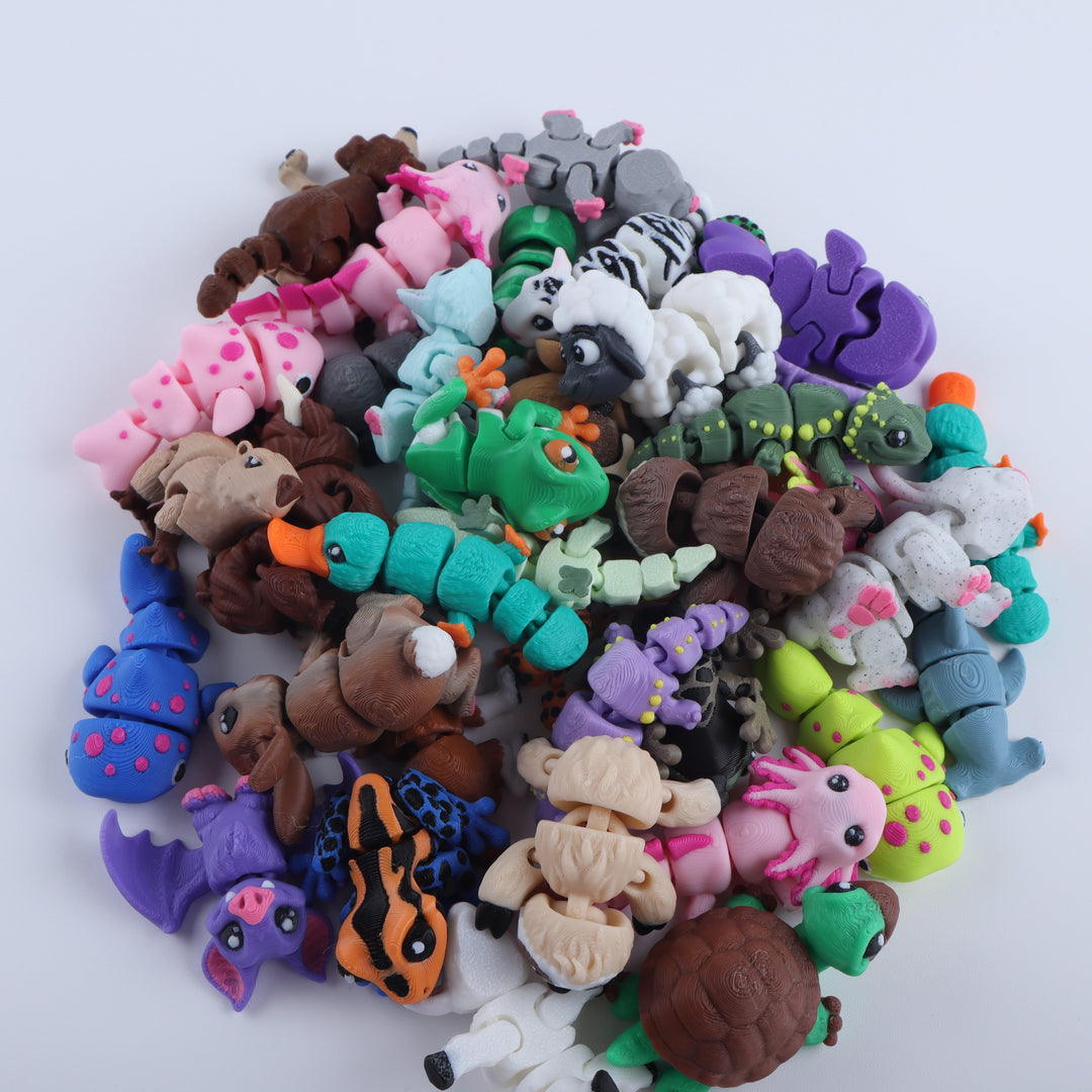Assorted colorful clay animal figurines on a white background