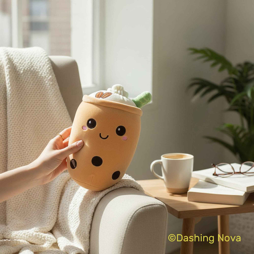 Person holding a plush boba drink toy in a cozy living room setting.